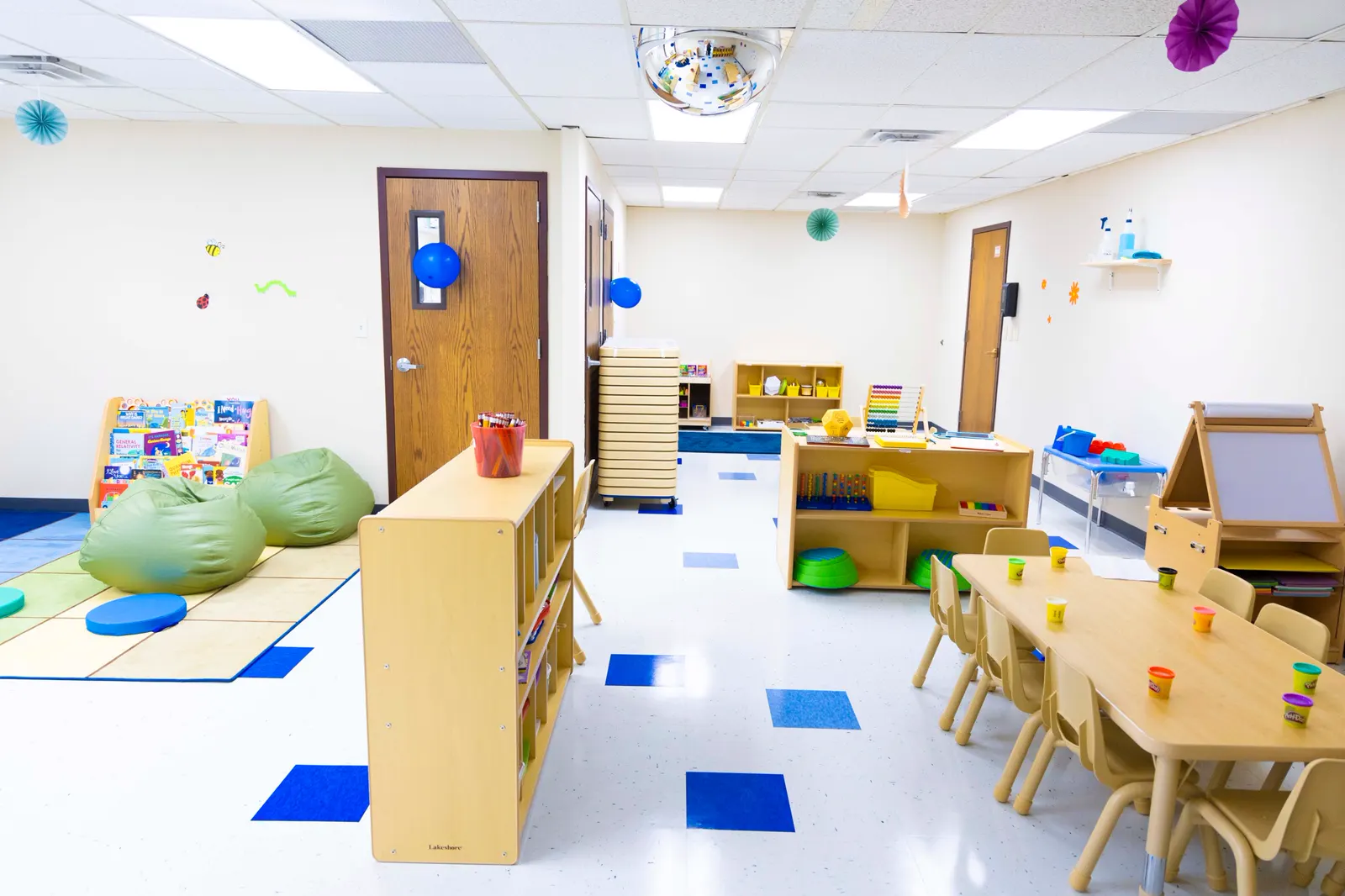Classroom with bean bags, bookshelves and play centers